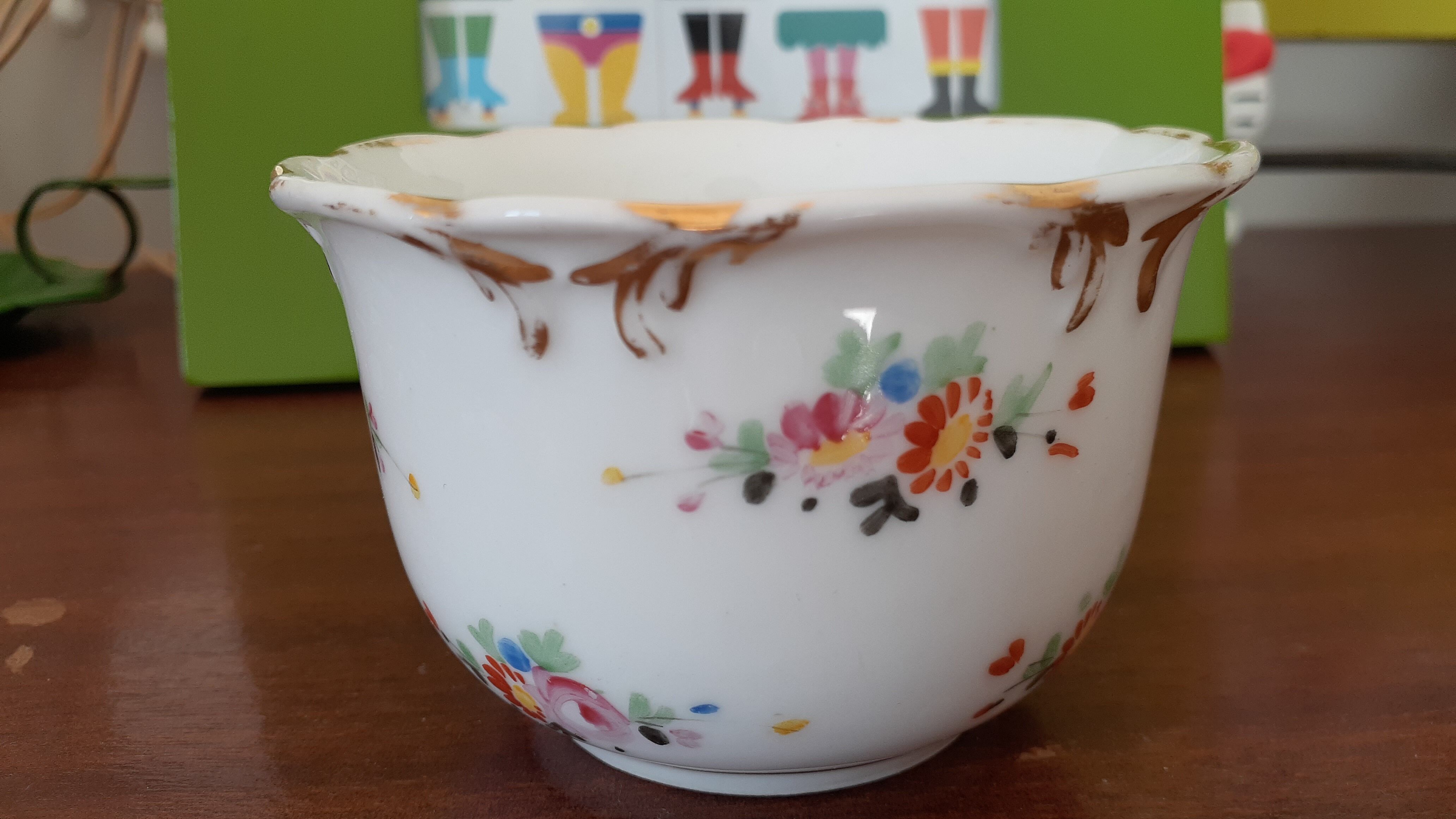 Antique flowered porcelain cup