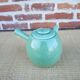 Old green ceramic kyusu teapot