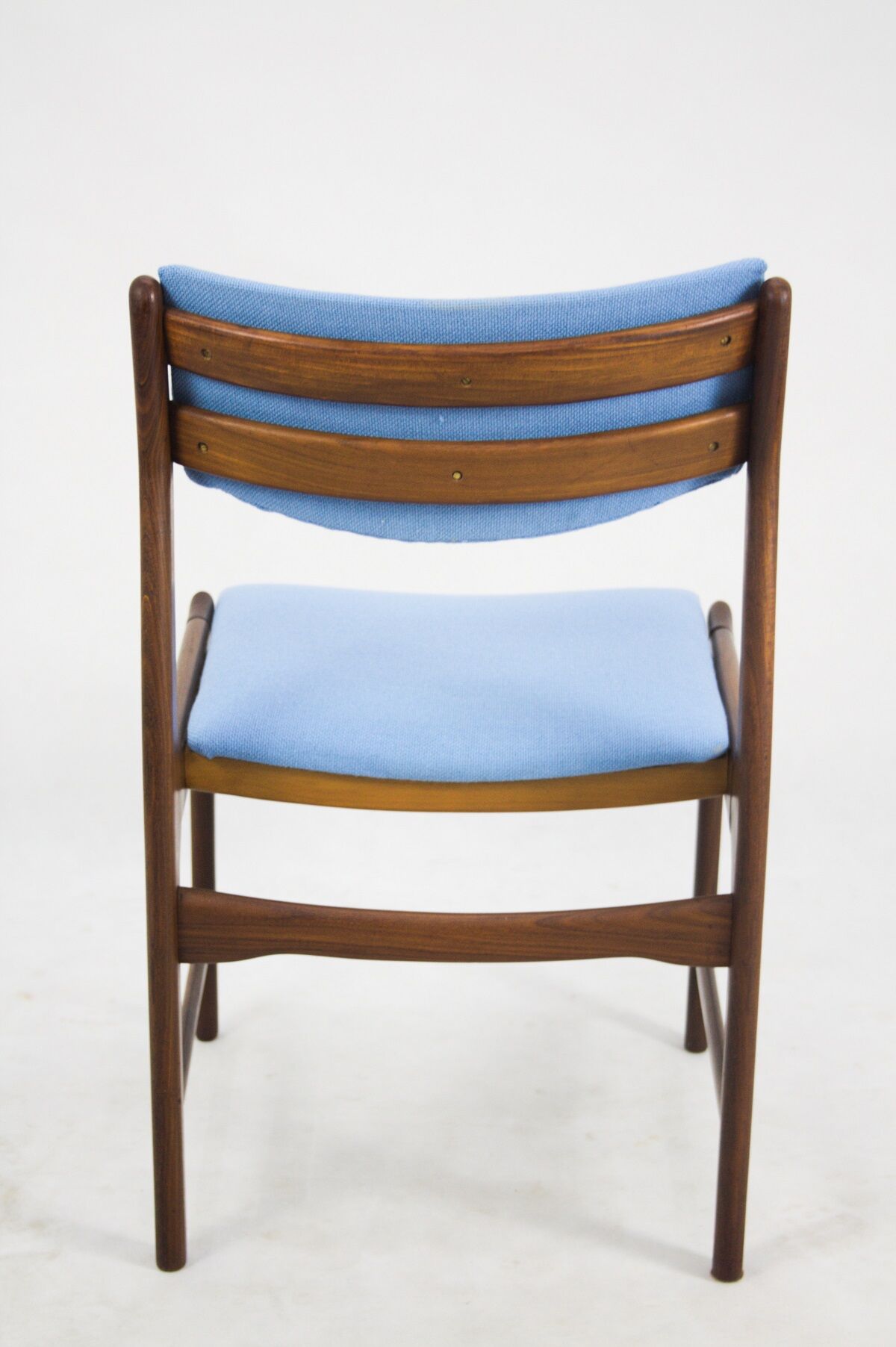 A set of 4 teak dining chairs,
