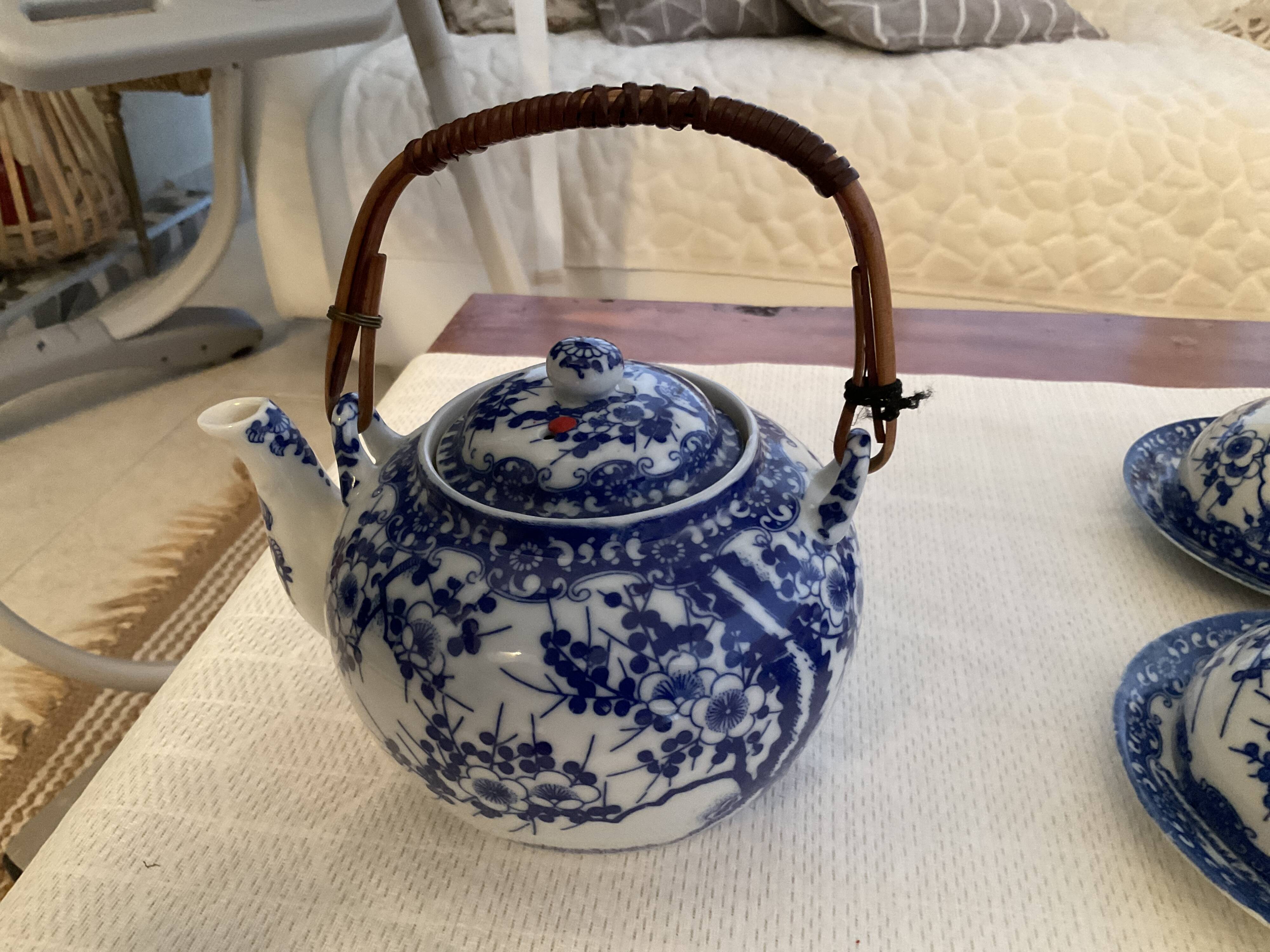 Japanese tea service with cherry blossom decoration in fine porcelain.