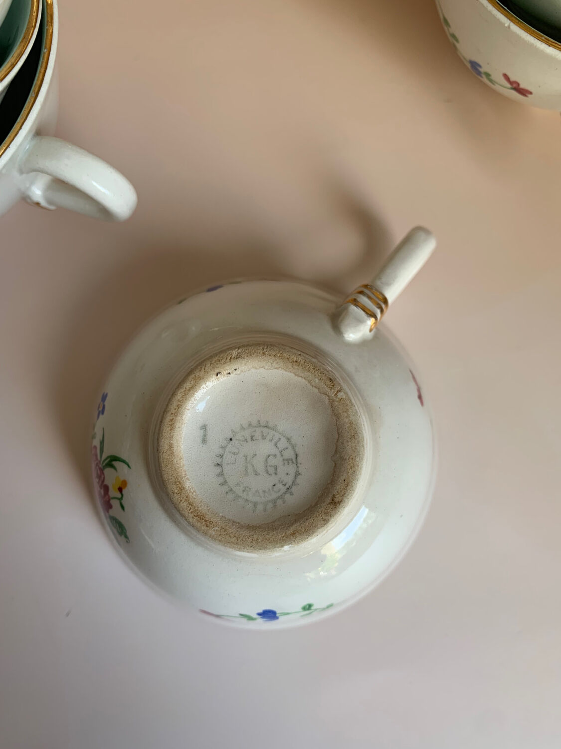 Set of 9 floral Luneville porcelain coffee cups with gold edges