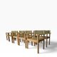 Vintage wooden chair with olive green seat and armrests.