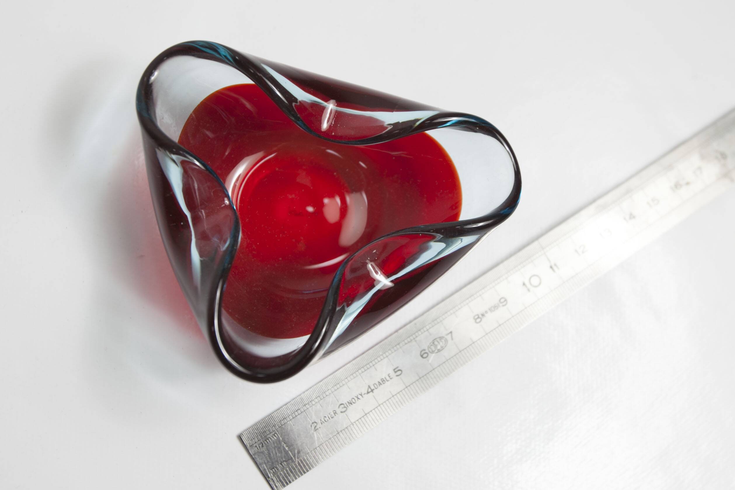 Asymmetrical ashtray murano red and transparent background 1960