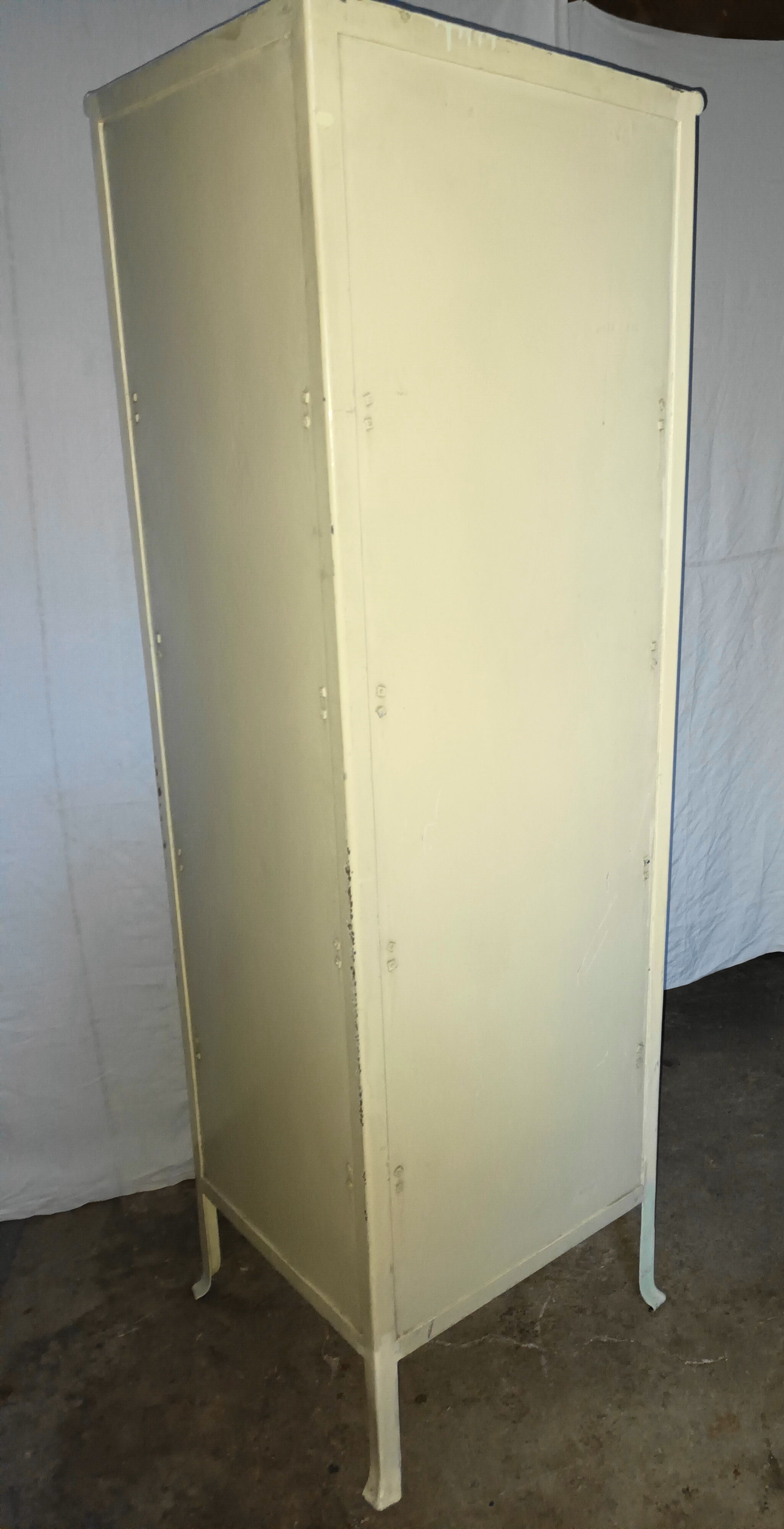 Painted metal ophthalmologist's corner display case, early 20th century