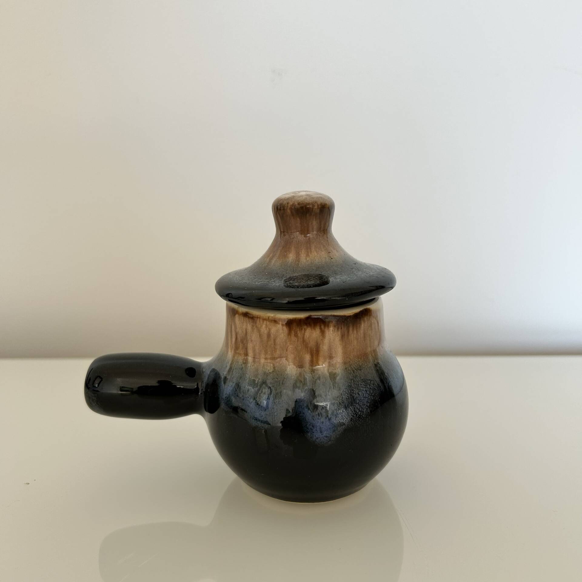 Blue flamed and black condiment pot