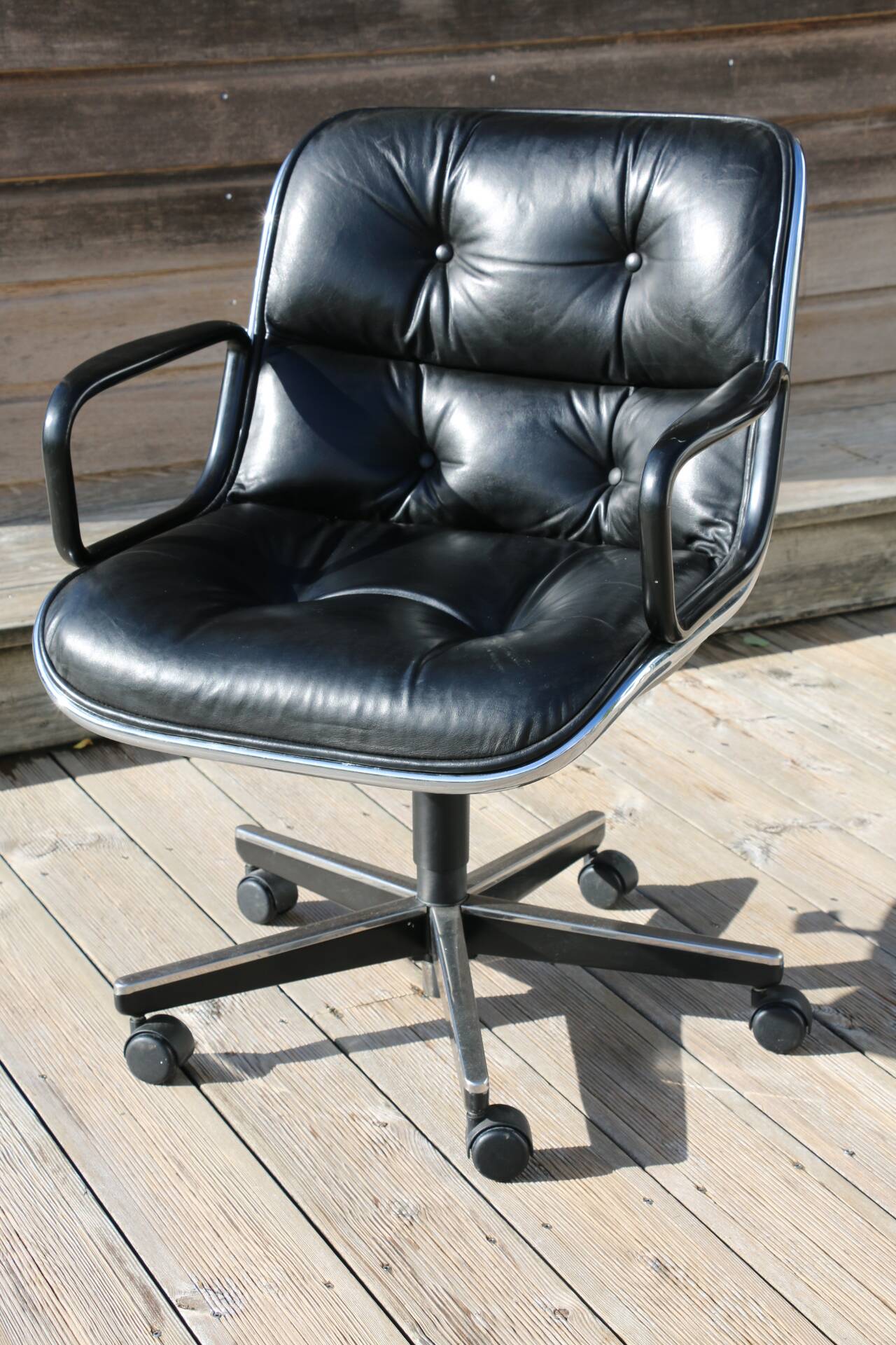 POLLOCK black leather reclining armchair with casters