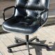POLLOCK black leather reclining armchair with casters
