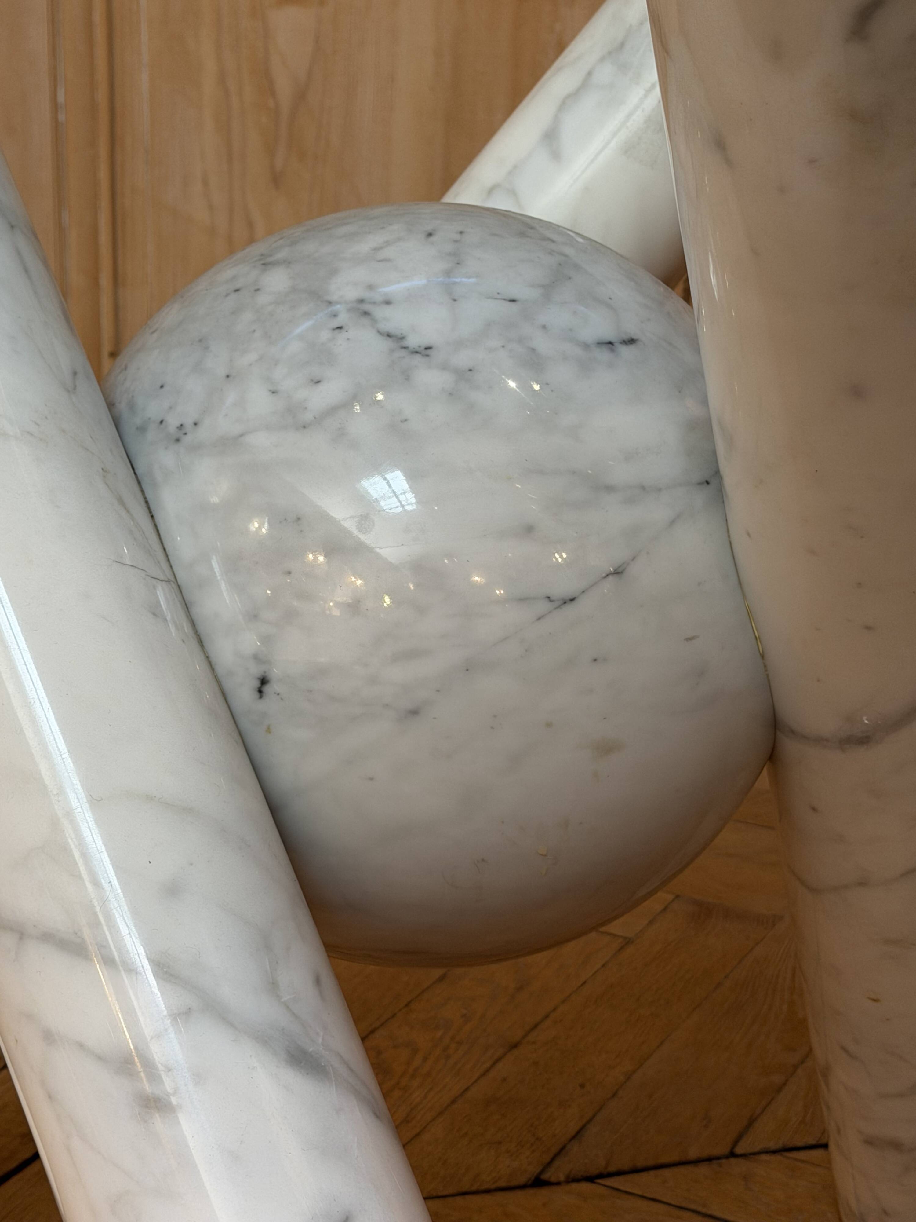 Dining table with glass top and marble base, Ligne Roset.
