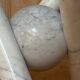 Dining table with glass top and marble base, Ligne Roset.