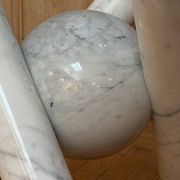 Dining table with glass top and marble base, Ligne Roset.