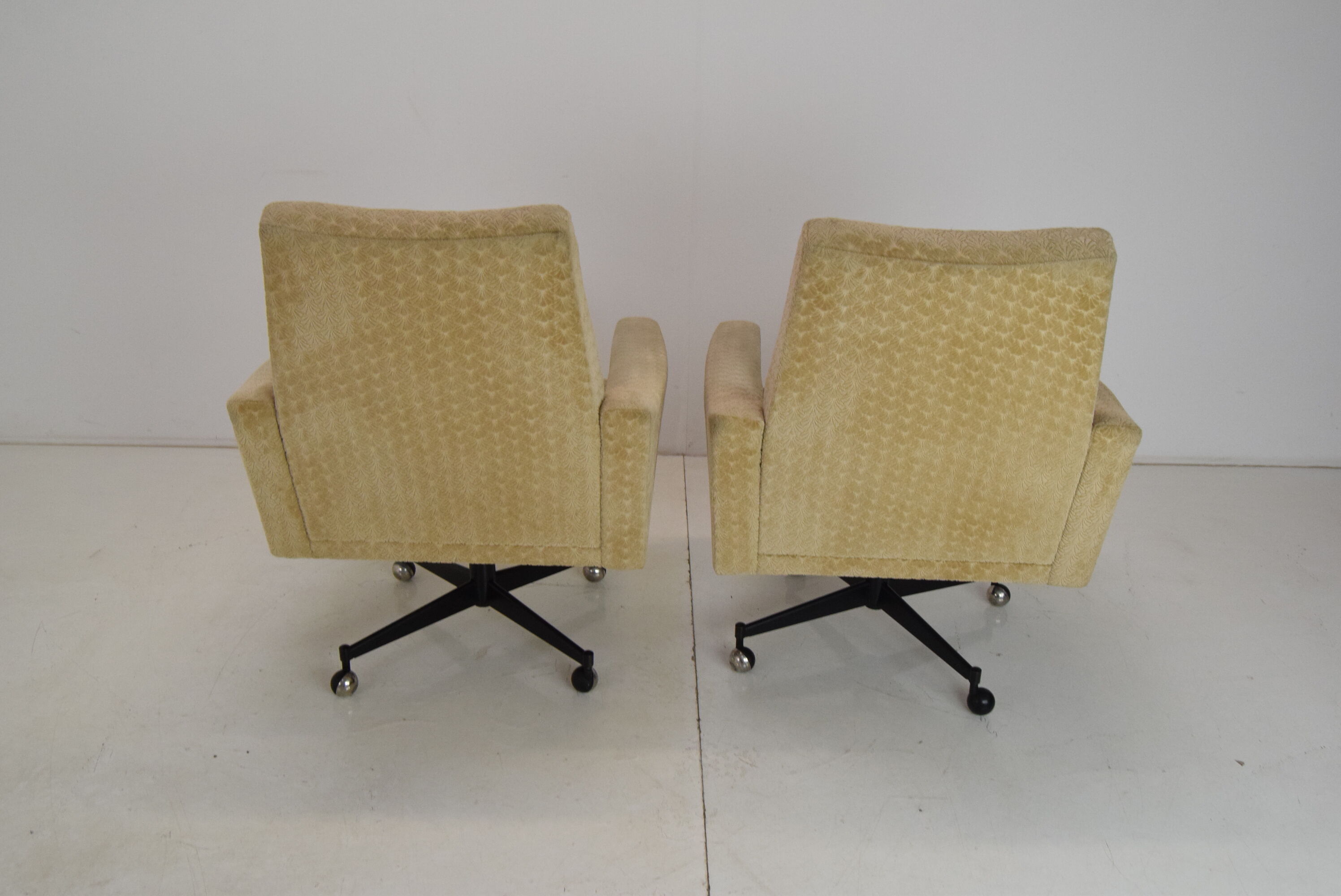 Pair of mid-century swivel armchairs with wheels 1970's