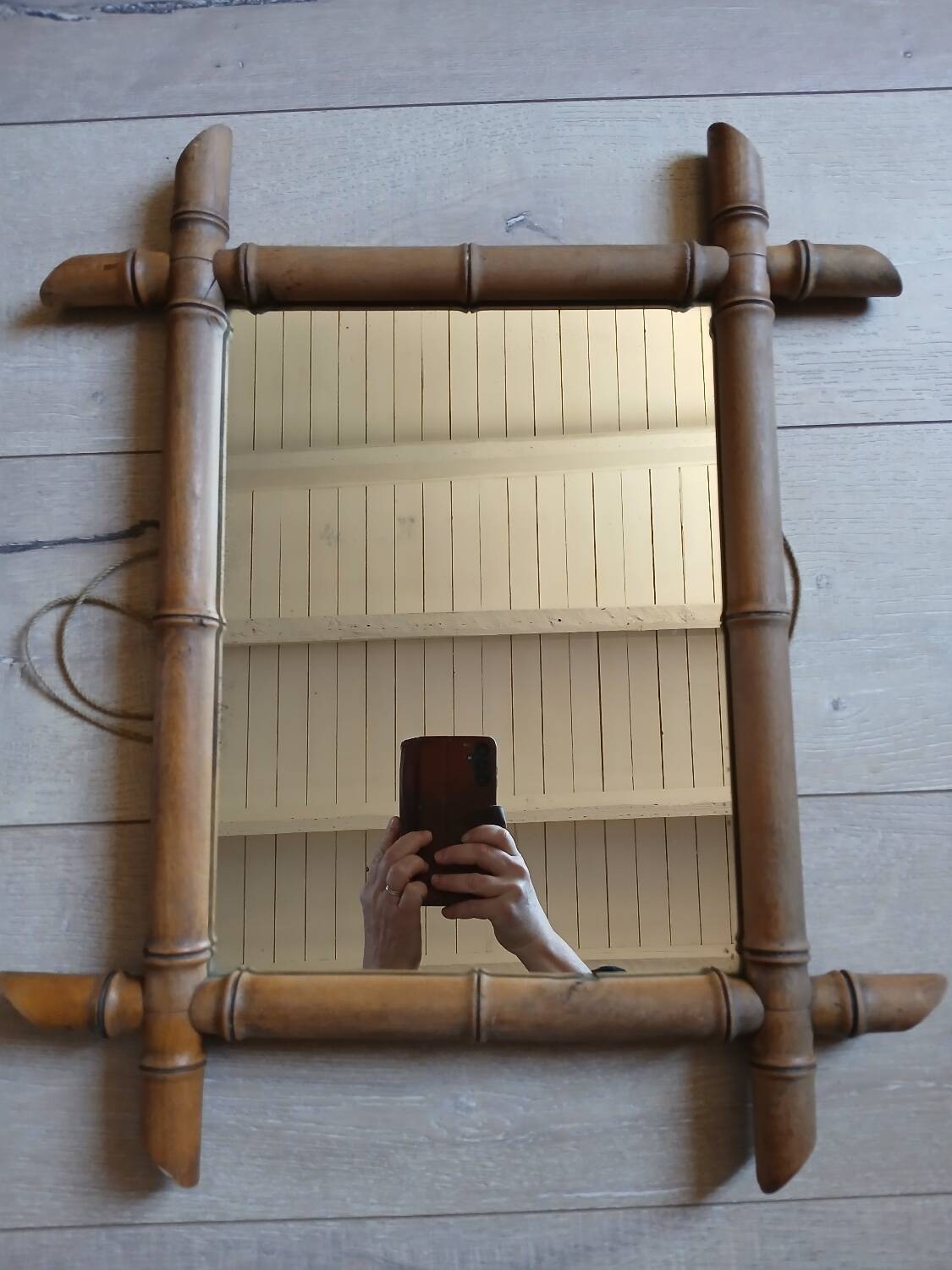 Antique wall mirror with a wooden frame