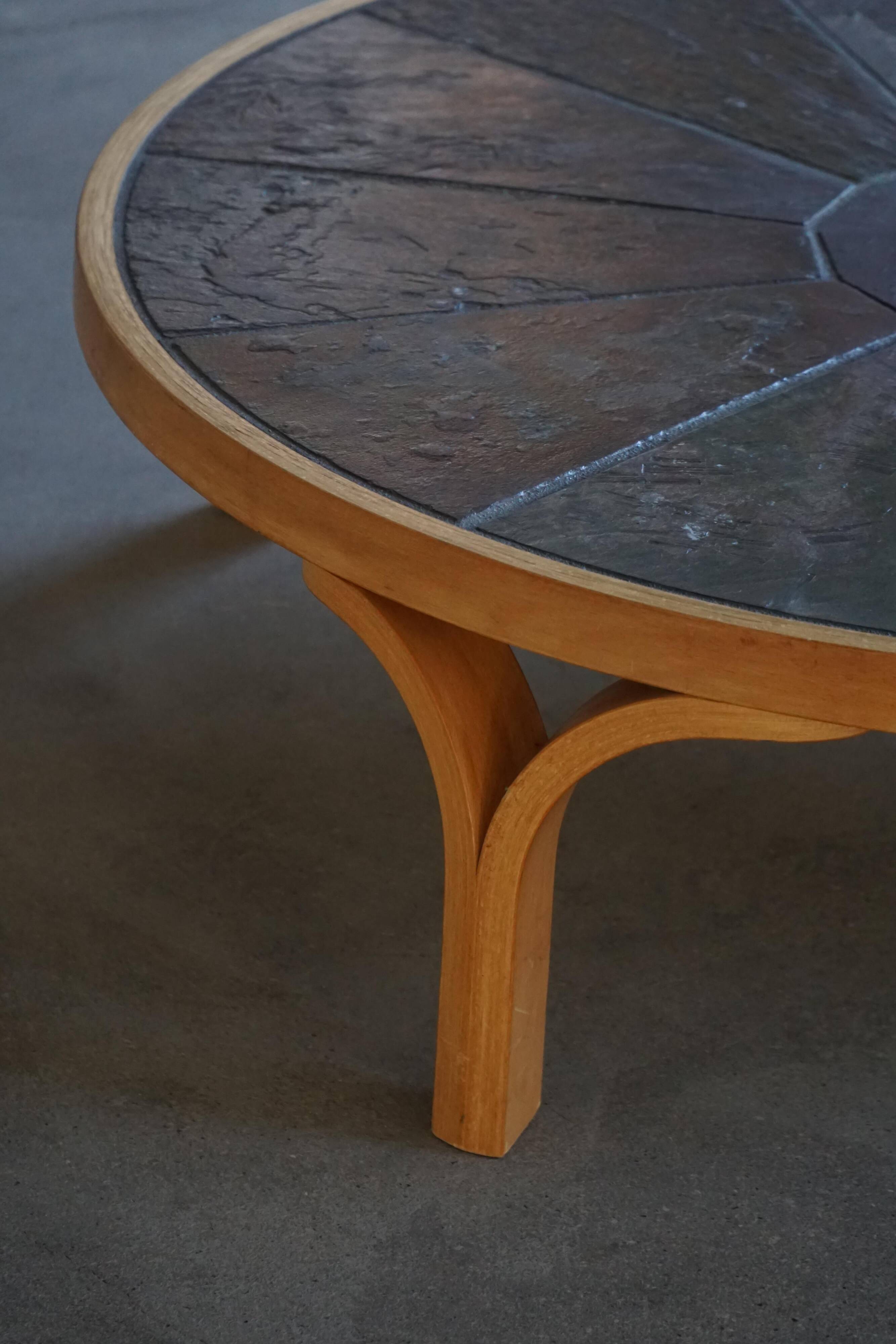 Mid-20th century modern Danish coffee table, wooden frame and ceramic top.