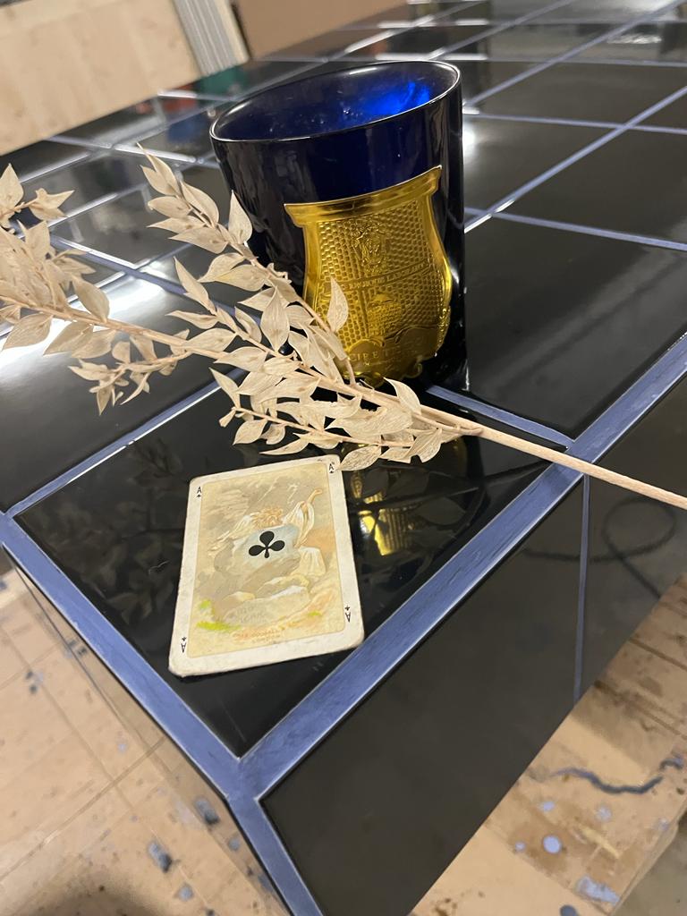 Black tiled coffee table and midnight blue grout