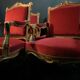 Pair of flat-back armchairs in Louis XV style in red velvet.