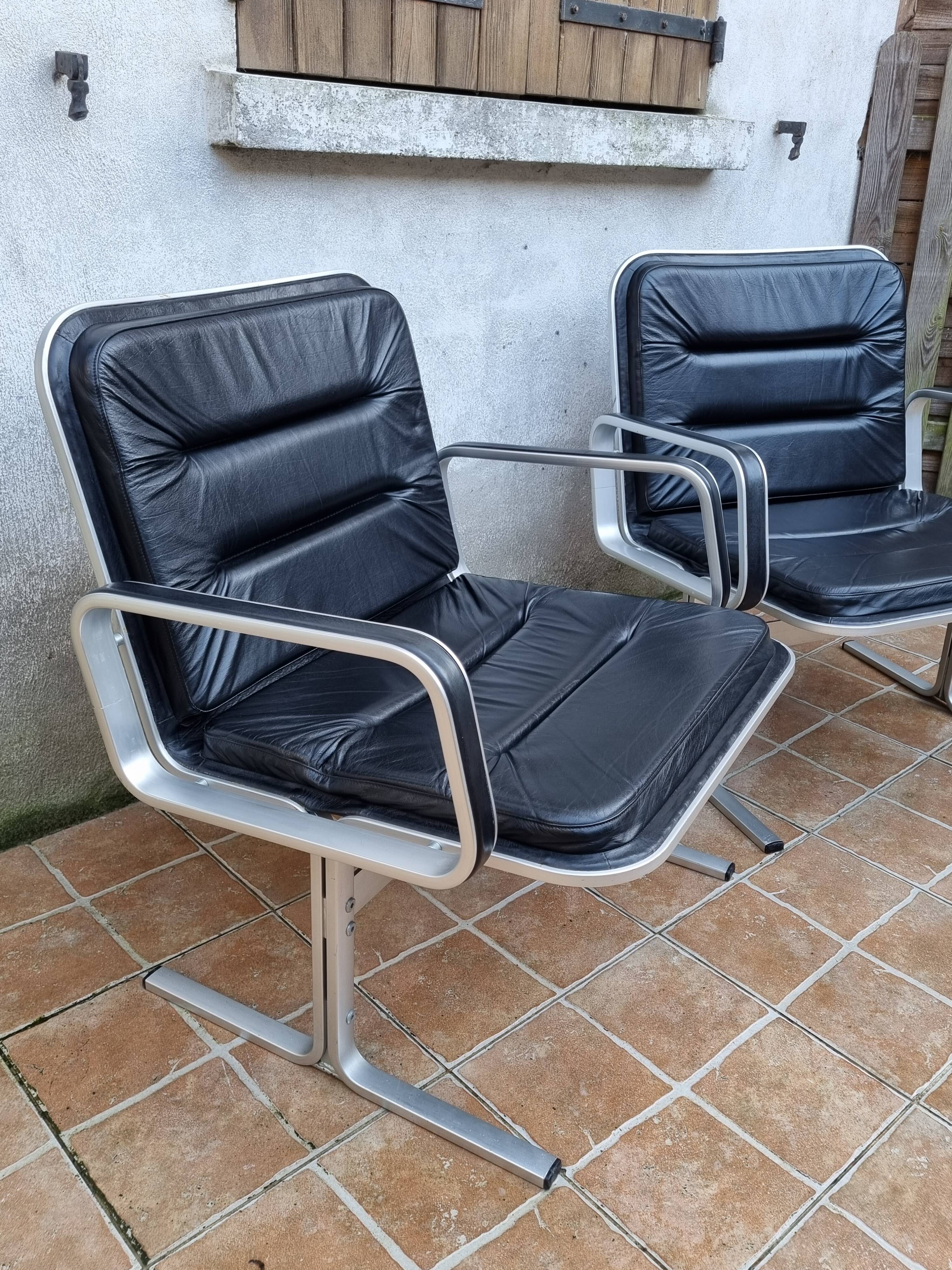 Pair of vintage leather and aluminum armchairs, restored