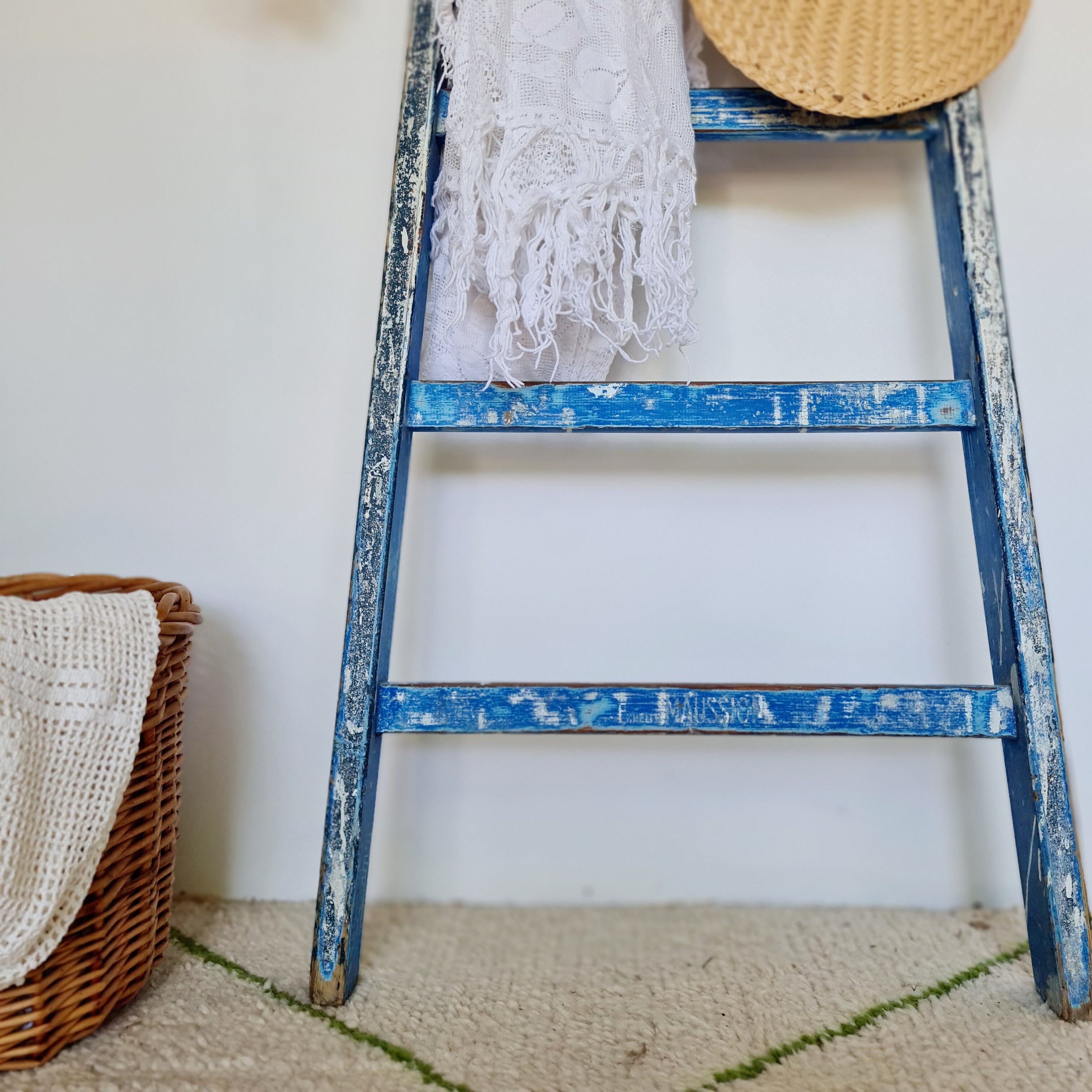 Old ladder in blue wood