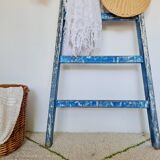 Old ladder in blue wood