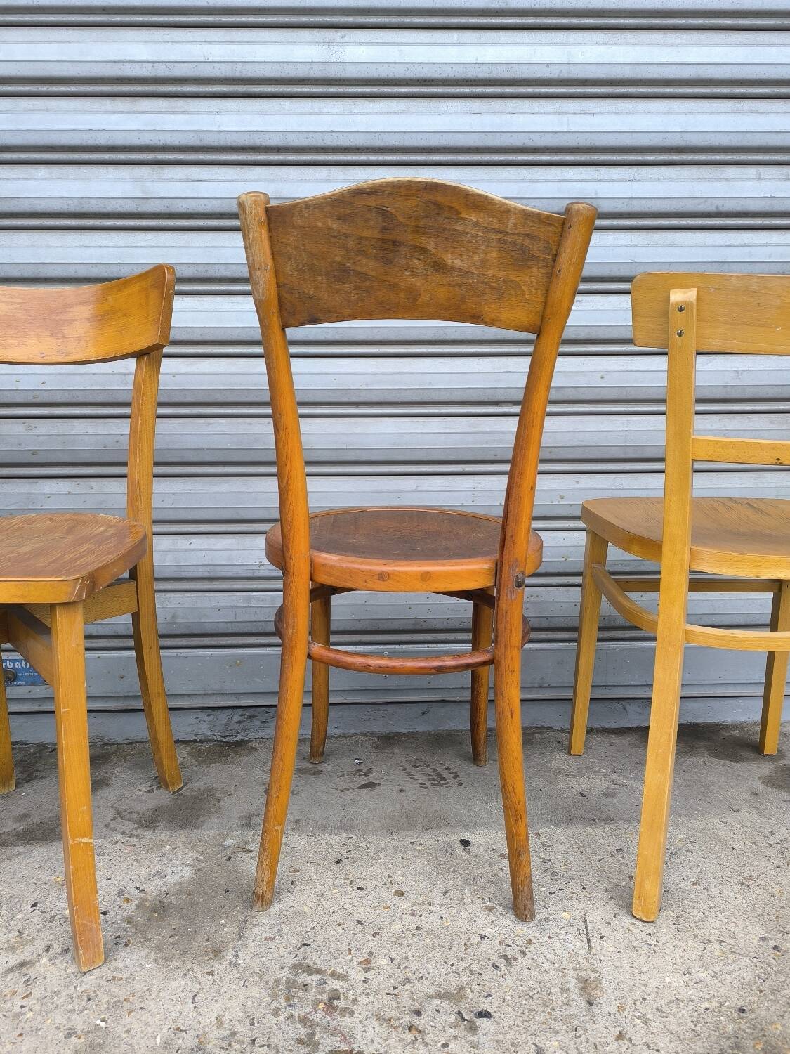 Set of four mismatched bistro chairs