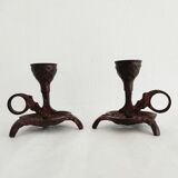 Pair of bronze hand-held candlesticks