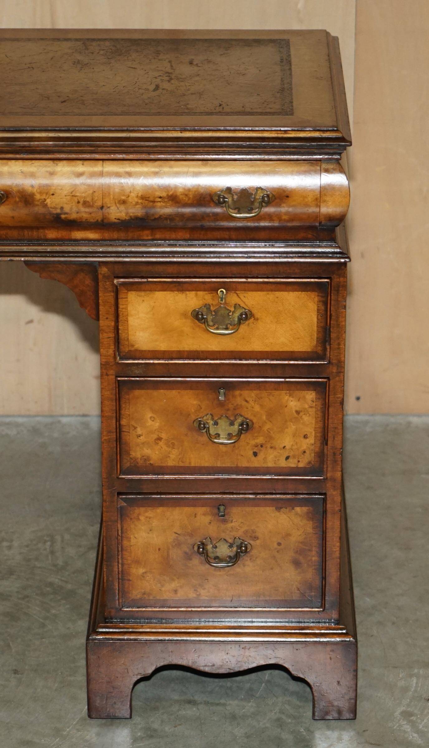 Victorian antique partner's desk in veined walnut with a leather top.