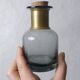 Smoked glass apothecary bottle with brass band