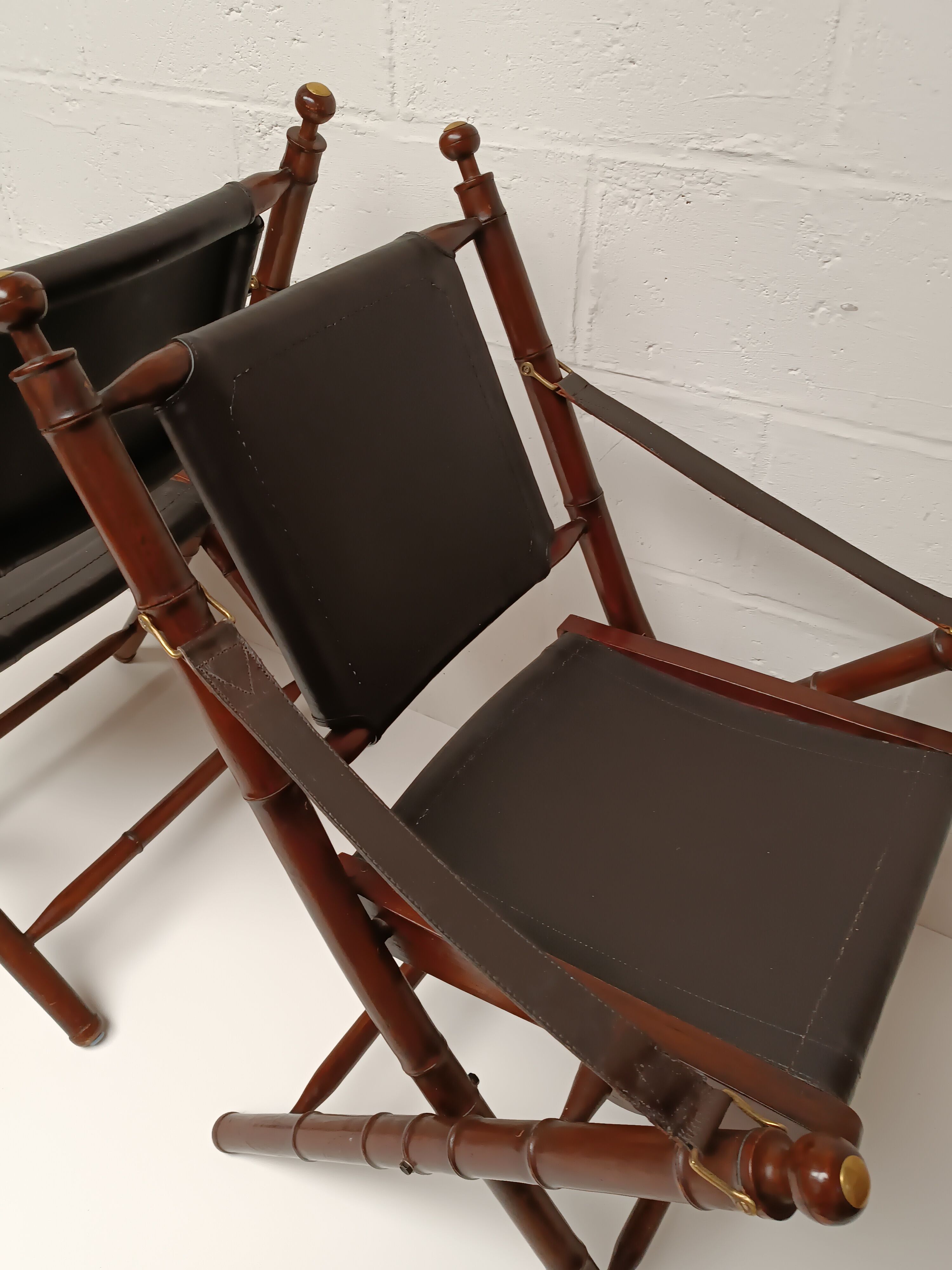 Pair of vintage "safari" folding armchairs in mahogany and leather