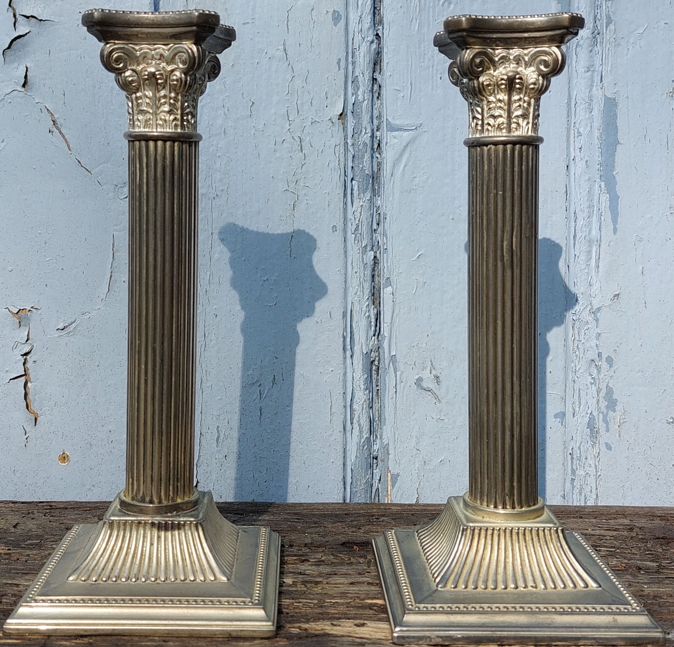 Duo of silver metal column candle holders