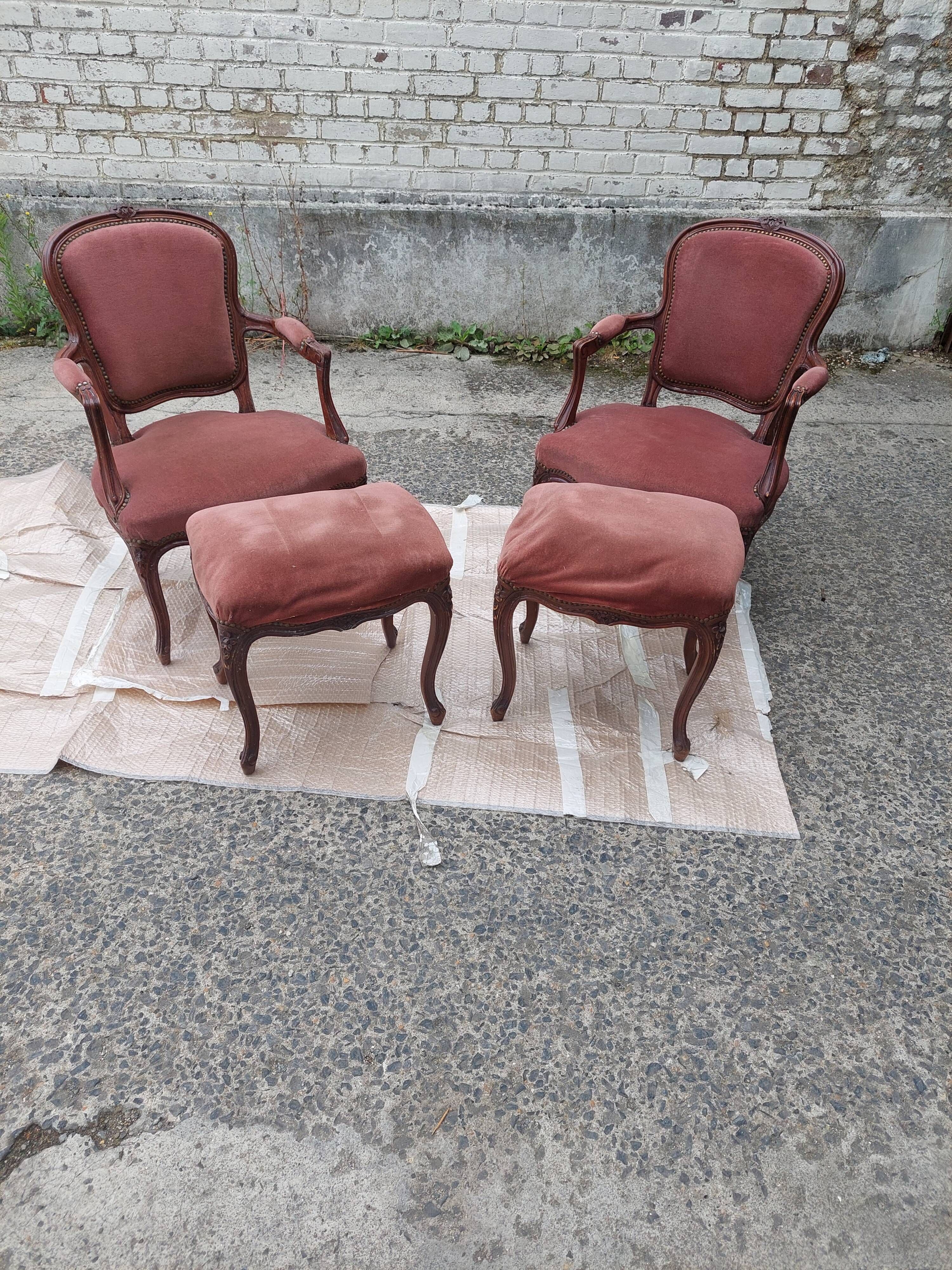 Pair of armchairs with Louis Philippe style footrests in walnut