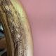 Gold oval mirror refurbished with a pediment — Louis XVI / Napoléon III style