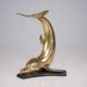 Solid brass dolphin console feet.