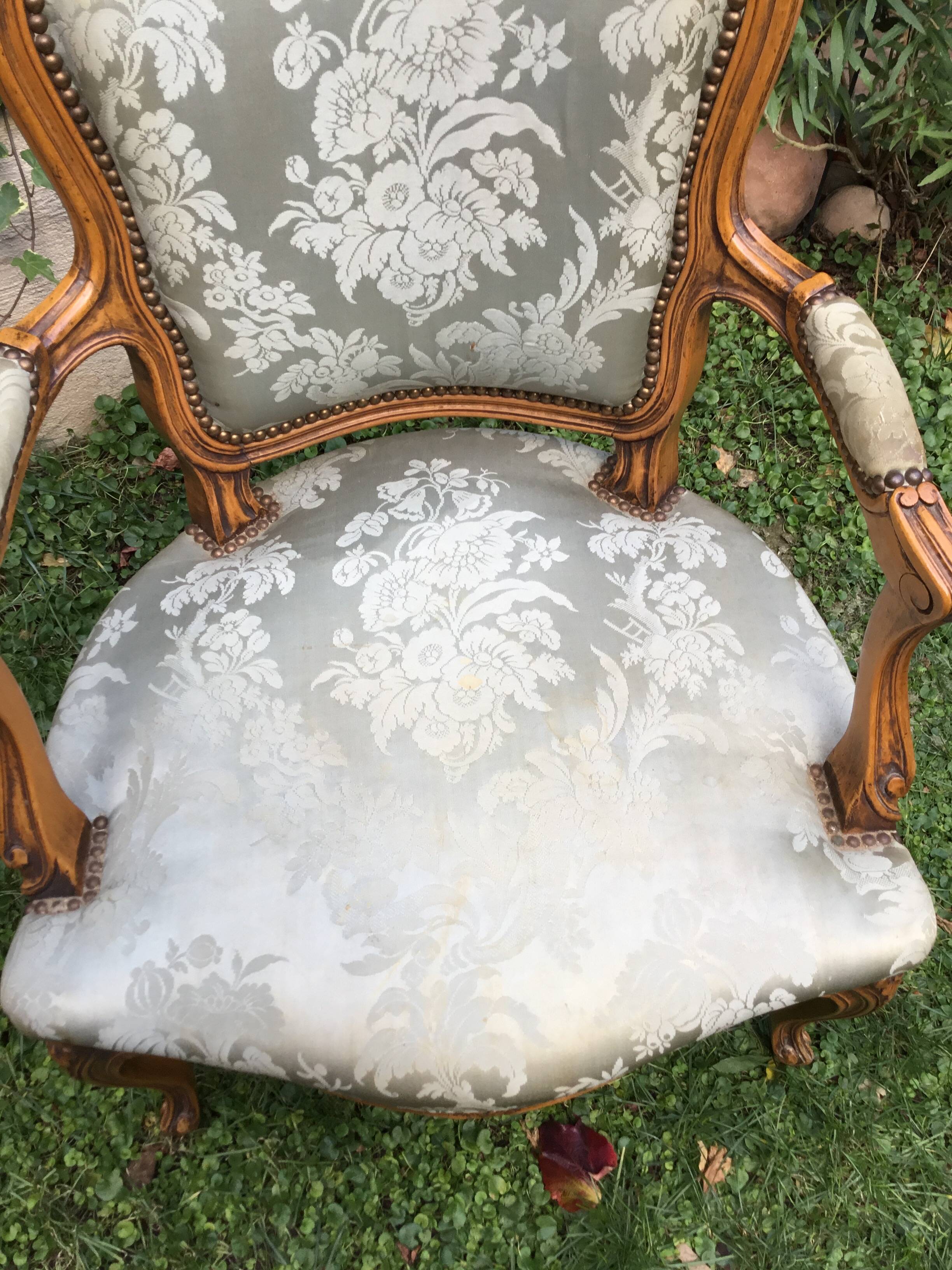 Pair of Louis XV style armchairs in moulded and carved beech.