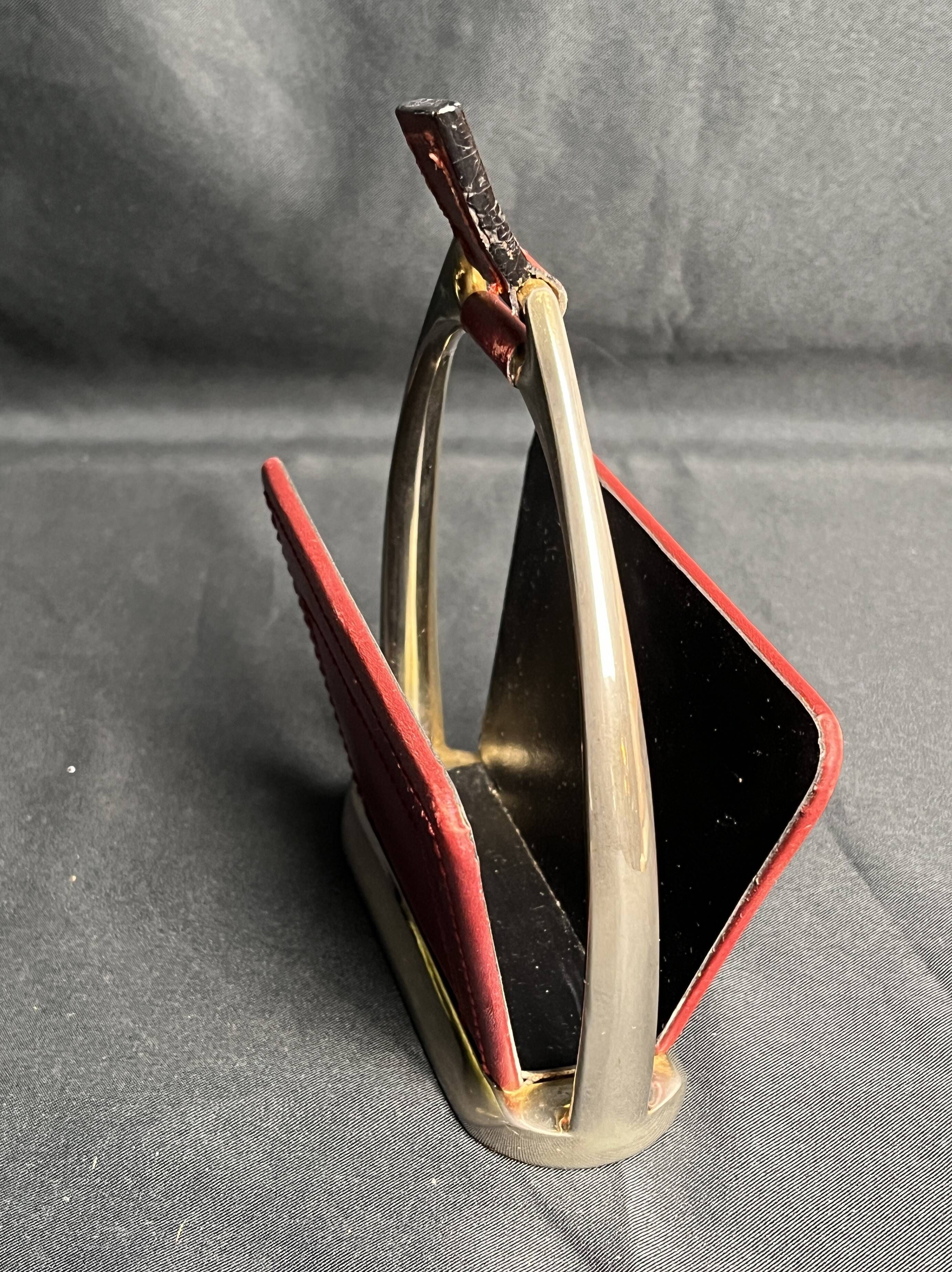 Longchamp, empty pocket document holder with leather and gold metal stirrup from around 1970.