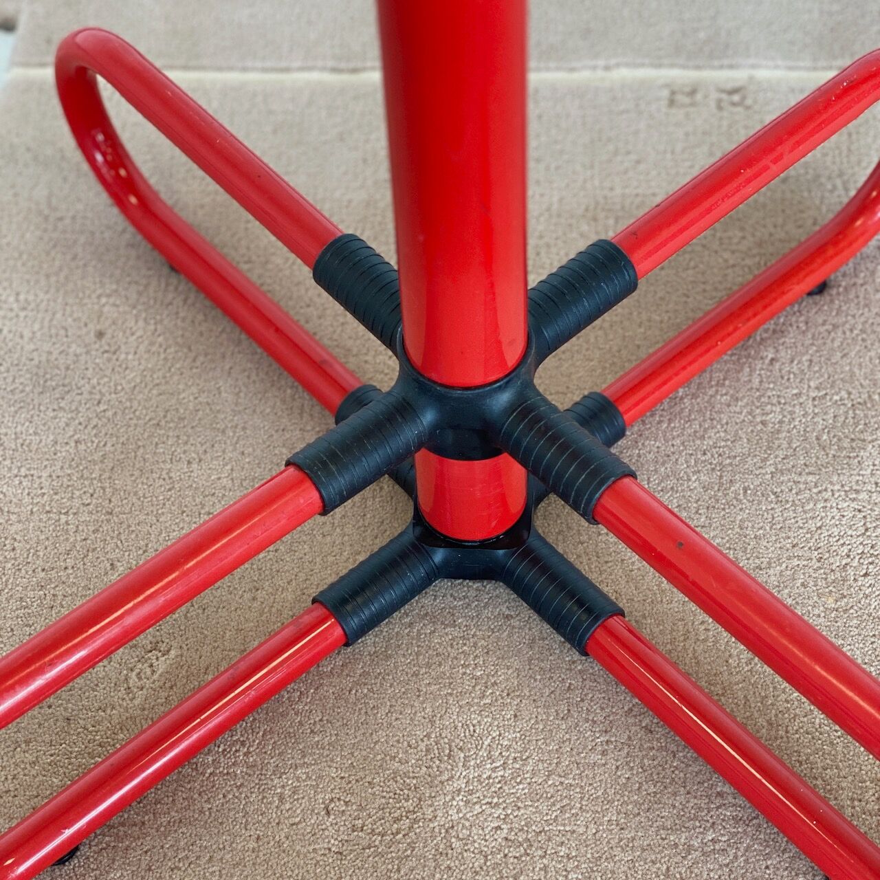Vintage red metal coat rack
