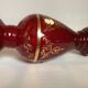 Cameo vase and red cabochons in burgundy glass