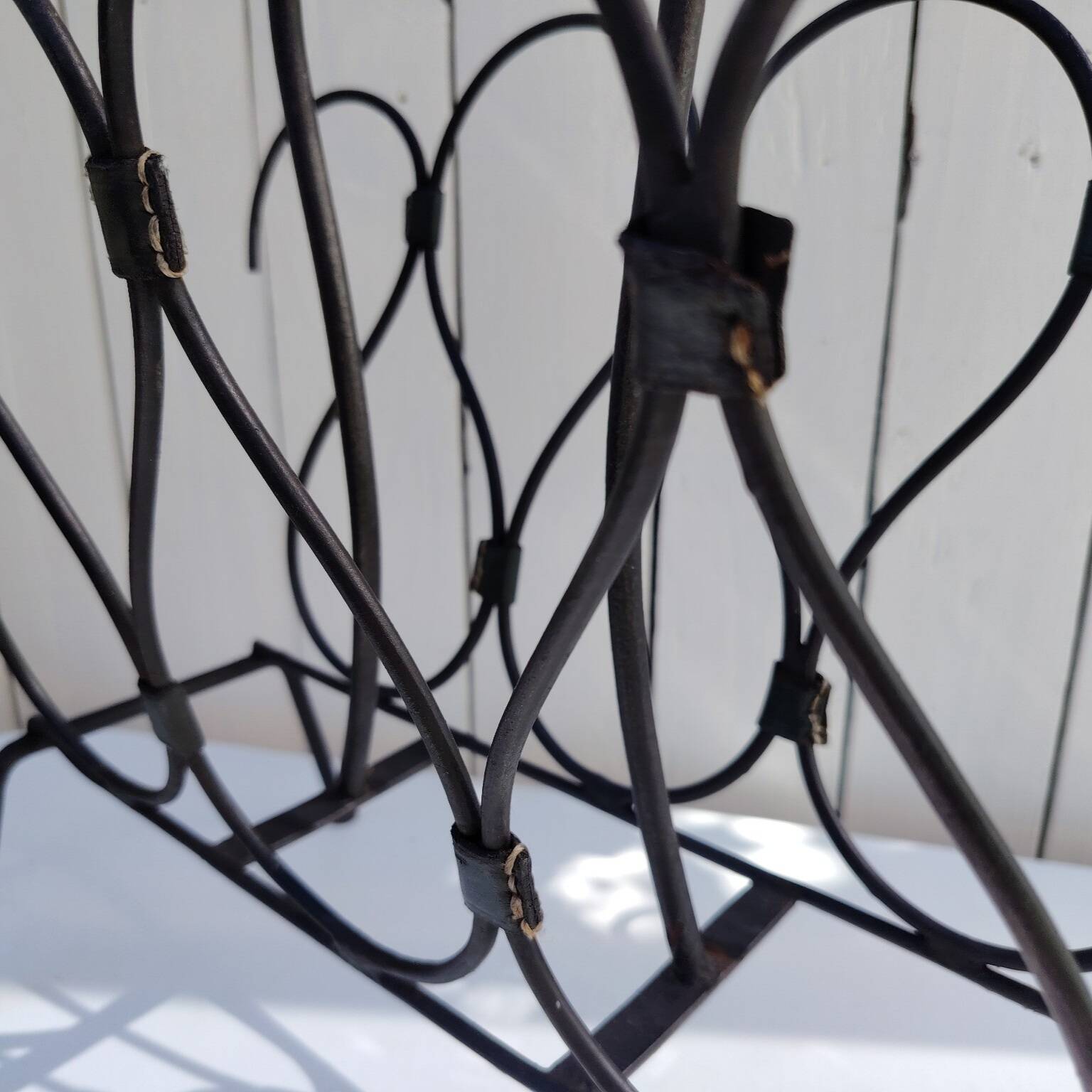 Metal and leather magazine rack, attributed to Jacques Adnet, vintage