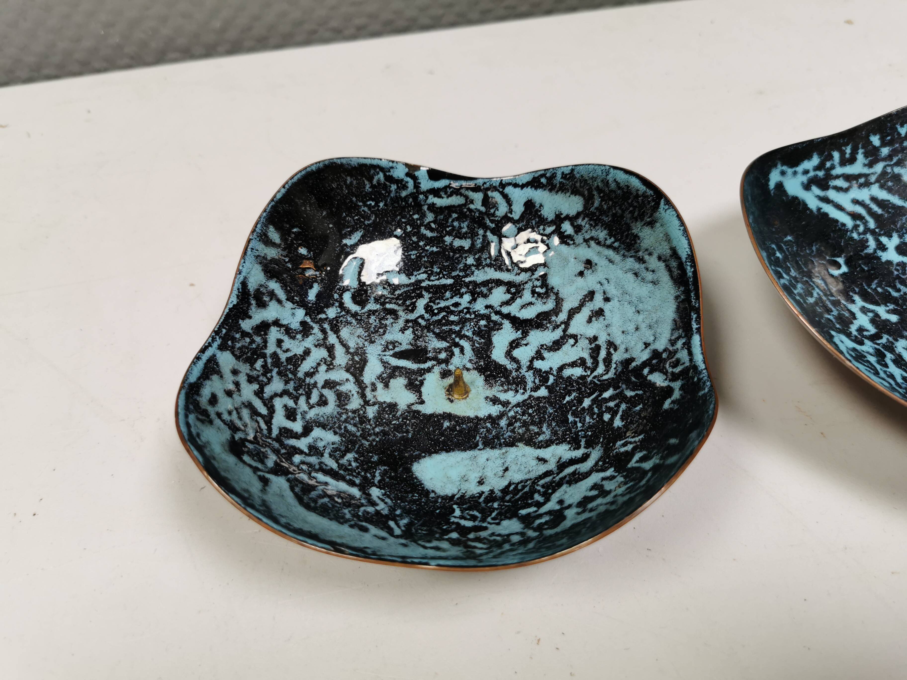 Set of candlesticks. Made of copper and blue/black enamel. From Danish Meka (1951 - 1989)