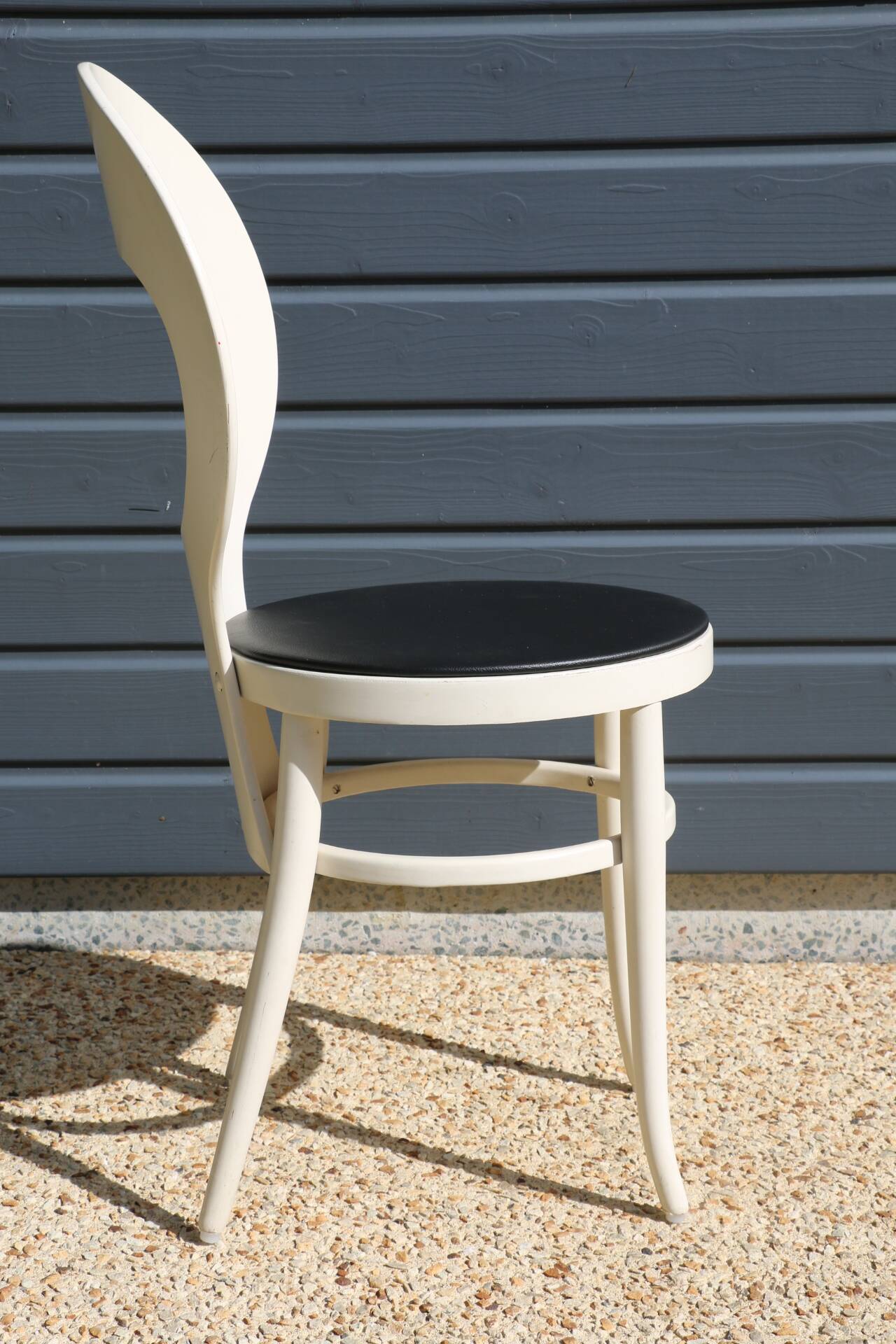 6 baumann chairs, white gull with black faux leather.