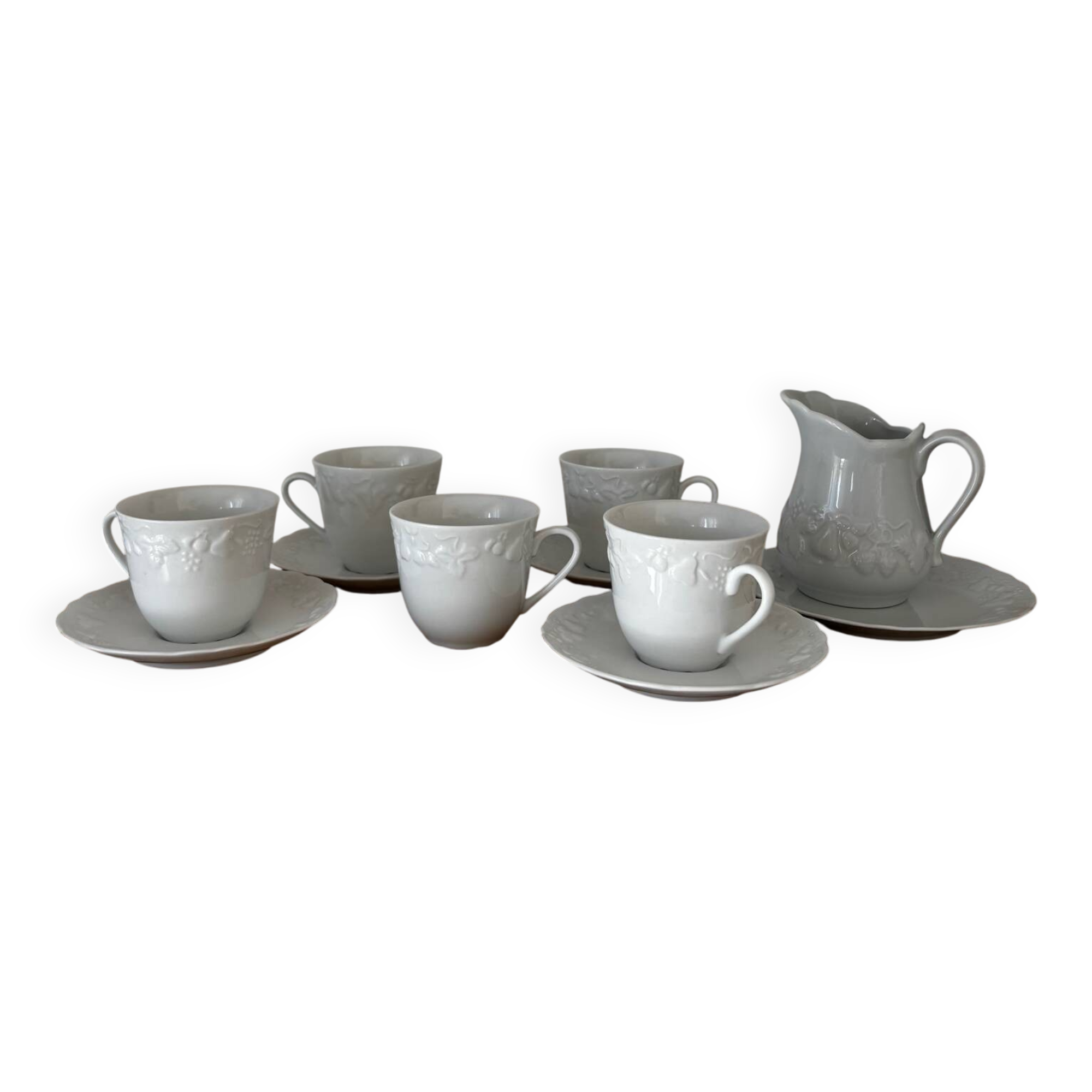 5 cups, 4 saucers and a creamer in Philippe Deshoulières porcelain