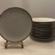 24 plates and a vintage porcelain dish decorated by Lucien Engel.