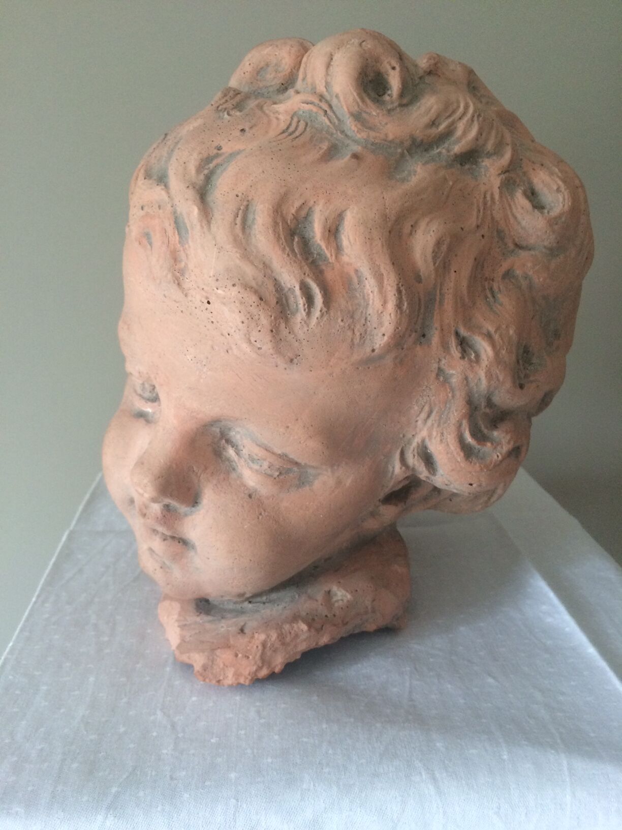Child bust in plaster