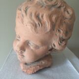 Child bust in plaster