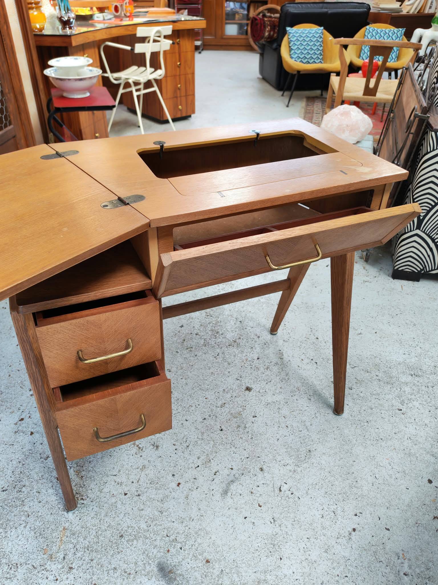 Vintage 1950s side desk with tapered legs.
