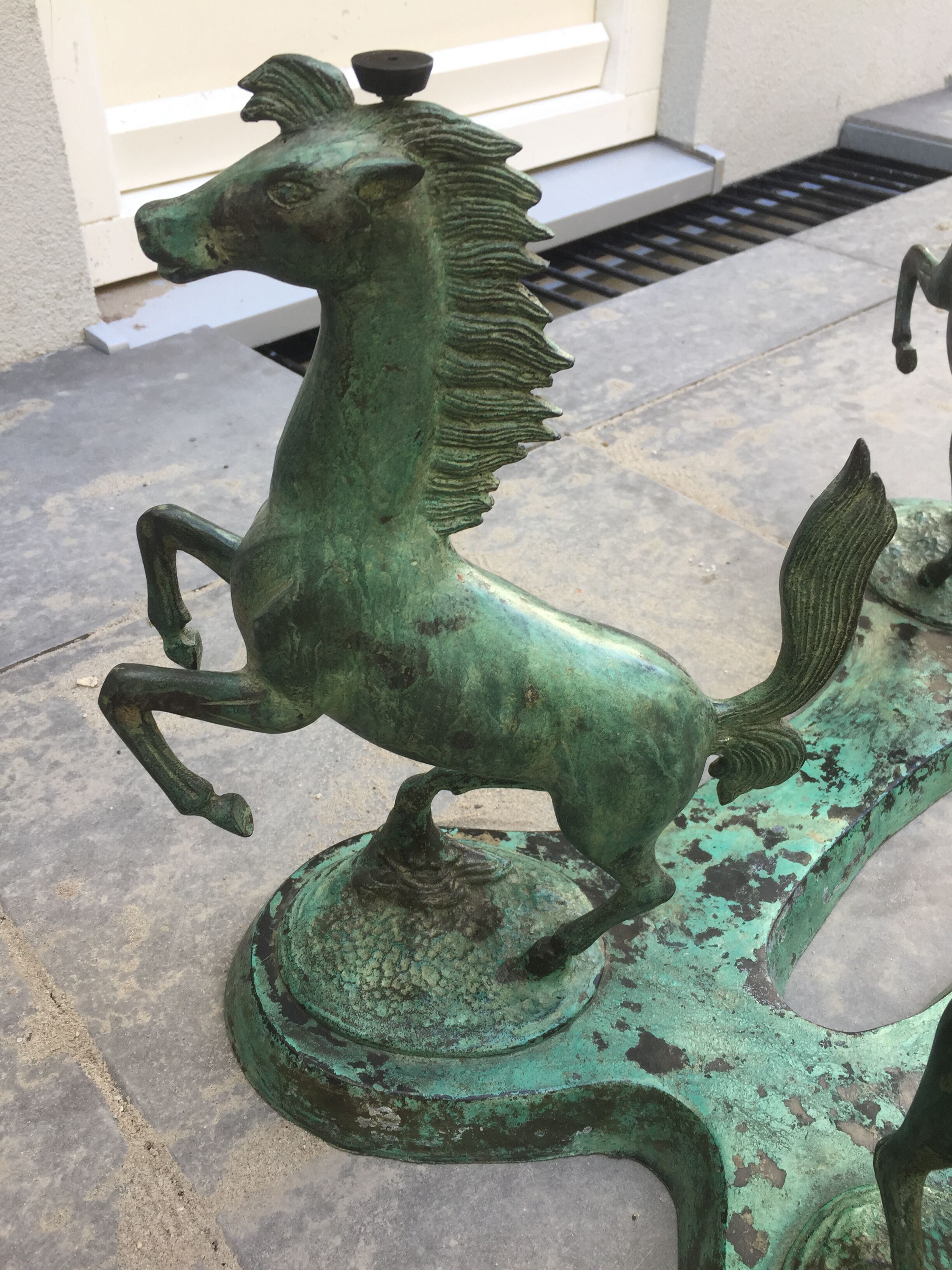 Coffee table with glass plate and bronze horses