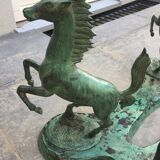 Coffee table with glass plate and bronze horses