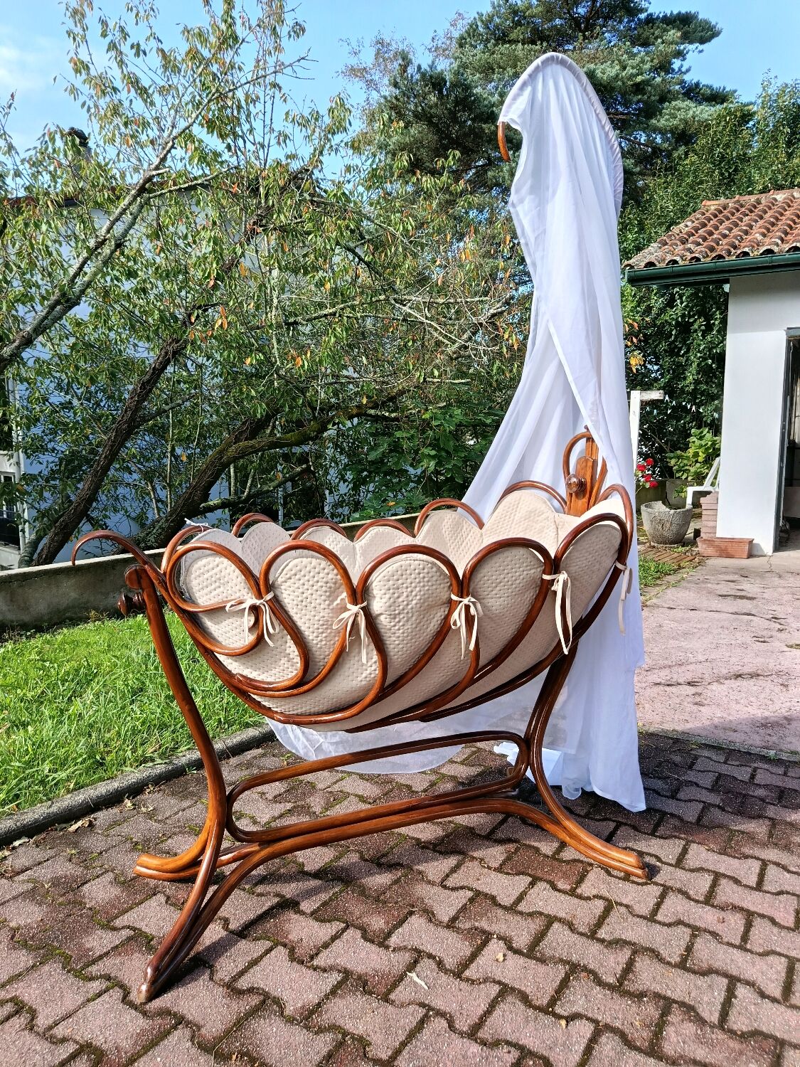 Antique cradle by J&J Khon