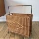 large wicker / rattan and black iron magazine rack from the 70s