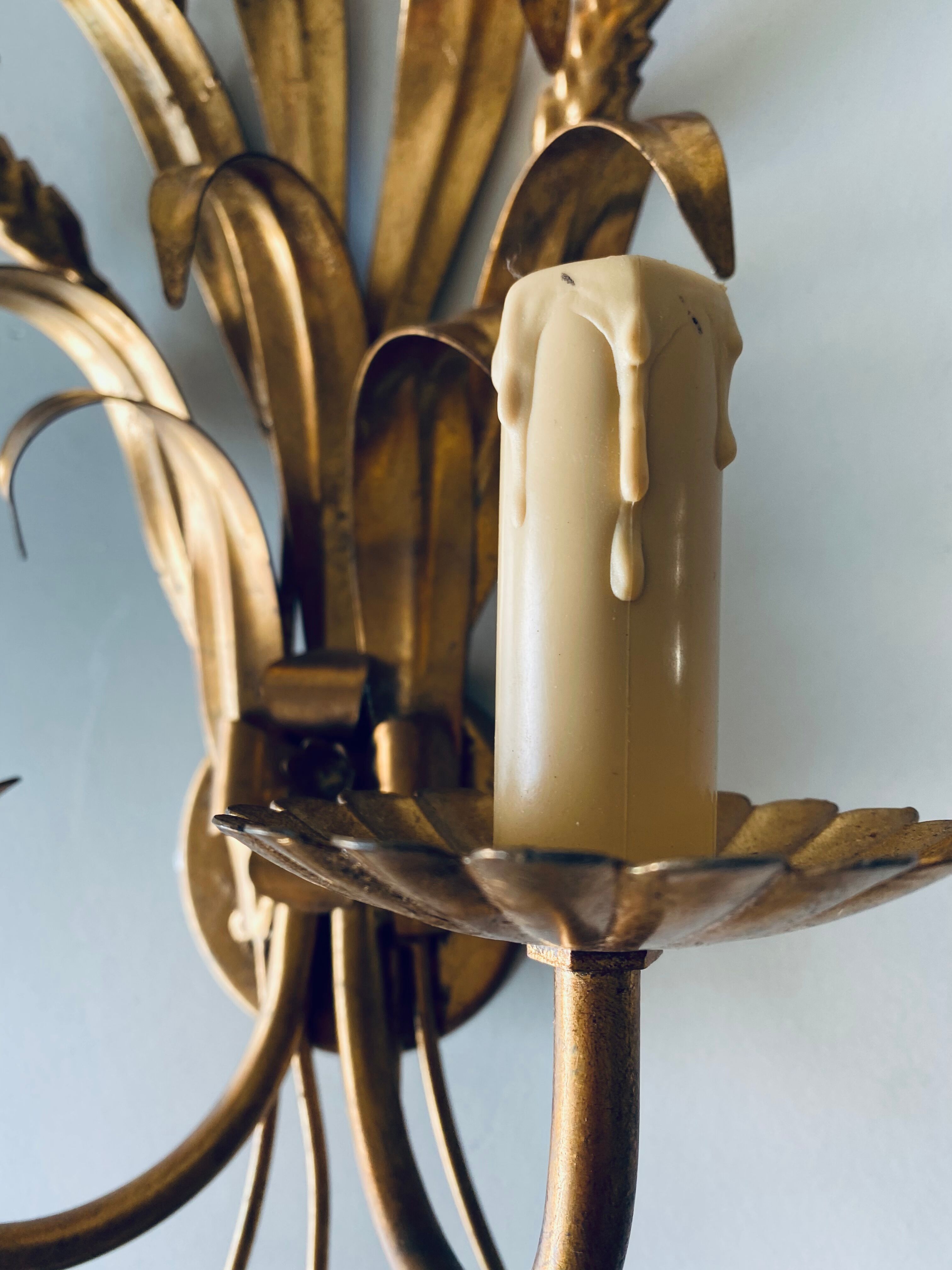 Double golden spike wall lamp