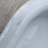 Antique bidet in enamelled sheet metal with wrought iron support