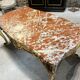 Table de milieu en bois doré d’époque napoléon iii dessus de marbre rouge